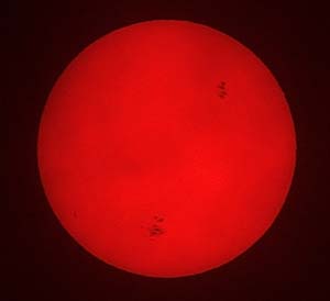 A 2003 photo of the sun, showing sunspots.